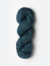 Skein of Blue Sky Fibers Woolstok yarn in the color teal