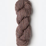 Skein of Blue Sky Fibers Woolstok yarn in the color dusty pink