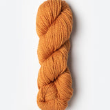 Skein of Blue Sky Fibers Woolstok yarn in the color orange