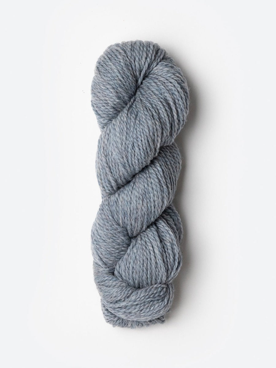 Skein of Blue Sky Fibers Woolstok yarn in the color light heathered grey