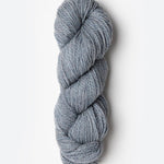 Skein of Blue Sky Fibers Woolstok yarn in the color light heathered grey