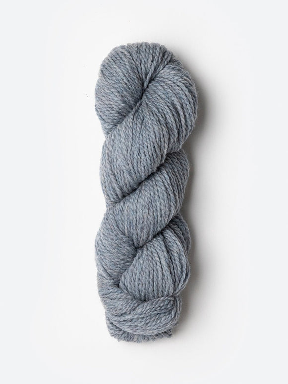Skein of Blue Sky Fibers Woolstok yarn in the color light heathered grey