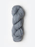 Skein of Blue Sky Fibers Woolstok yarn in the color light heathered grey