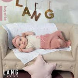 Lang, Baby laying on a couch, Pink Star