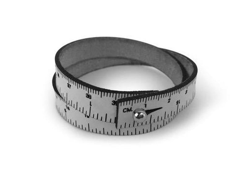 A photo of a gray leather wrist ruler