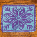 A double knitted colorful pot holder