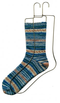 A photo of a sock on a sock blocker