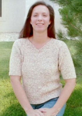 A woman wearing a knitted sweater