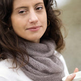A woman wearing a knitted cowl