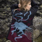 Woman in a Lopi sweater with a volcano on the back
