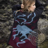 Woman in a Lopi sweater with a volcano on the back