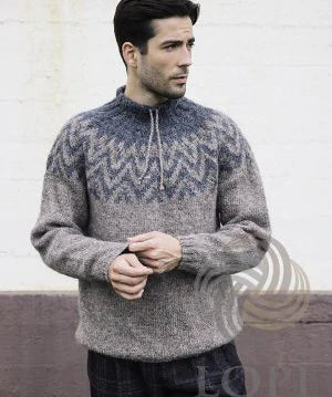 Man in a gray and blue Lopi sweater