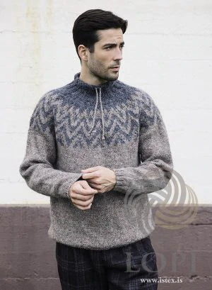 Man in a gray and blue Lopi sweater