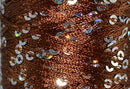 A close-up photo of SWTC String Me Along brown colored sequined thread