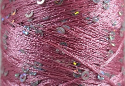 A close-up photo of SWTC String Me Along pink colored sequined thread