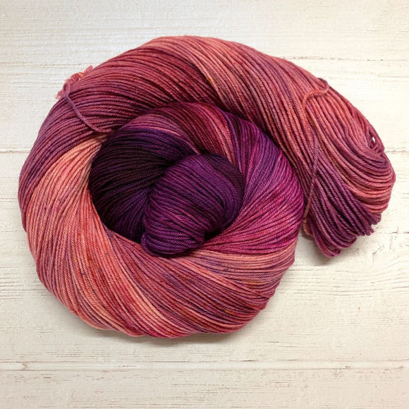 Skein of Truth Teller, a rose/magenta/peach yarn
