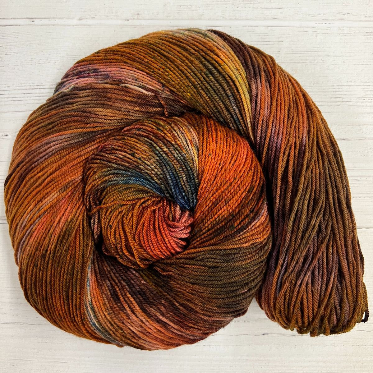 Knitted Wit Herstory October 2022- Roots of Resistance, an autumnal yarn swirled into spiral