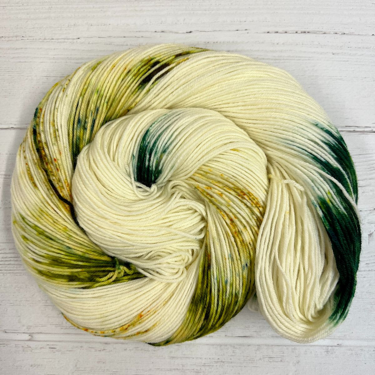 Herstory Nov 2022, Braiding Sweetgrass- cream and green skein wrapped into a swirl