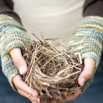 Woman wearing fingerless mitts