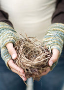 Woman wearing fingerless mitts