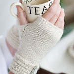 Woman wearing fingerless mitts